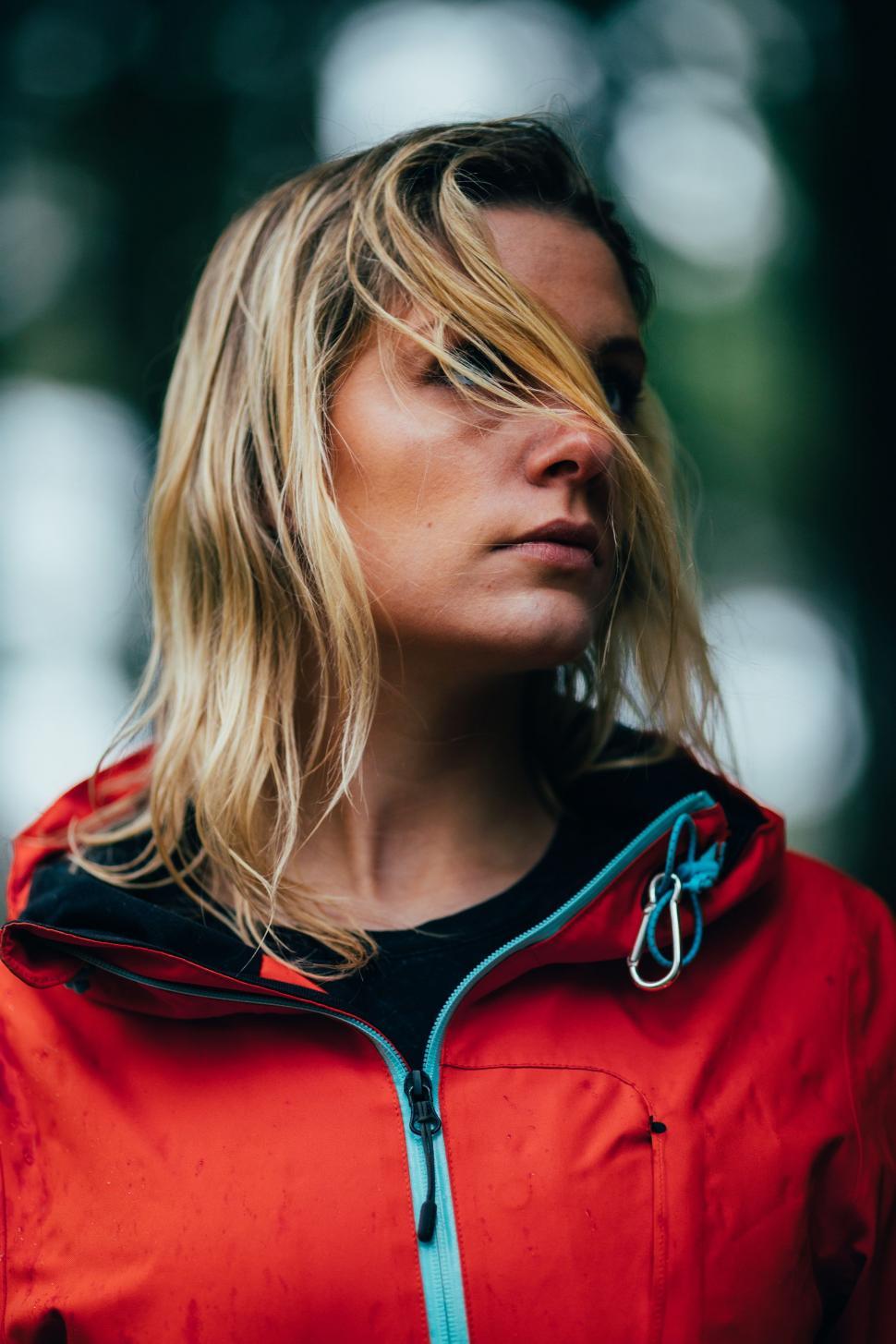 Free Image of Woman in a Red Jacket Gazing Into the Distance 