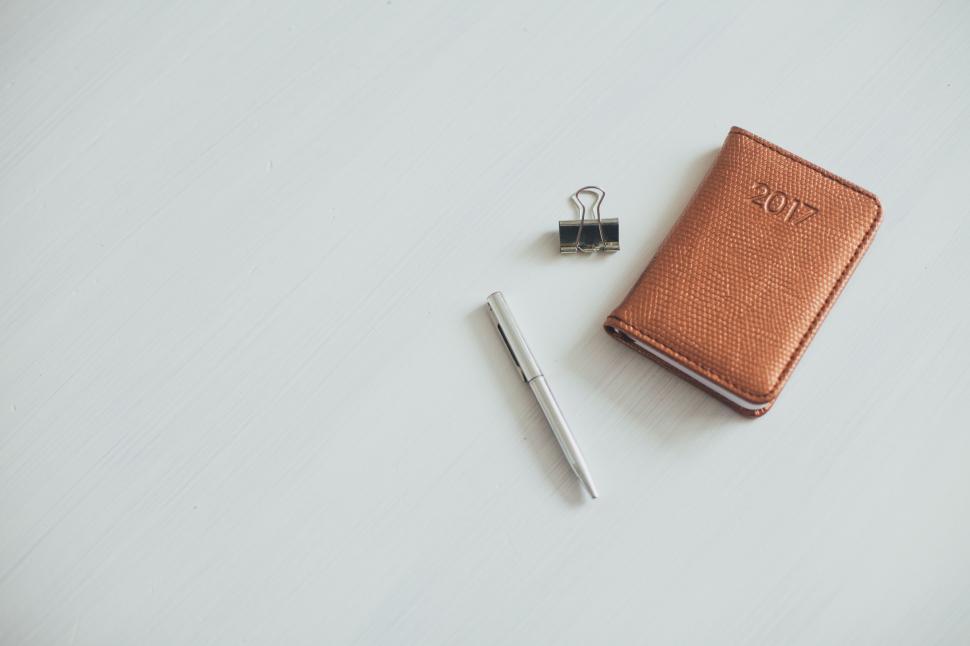 Free Image of Notebook, Pen, and Scissors on White Surface 