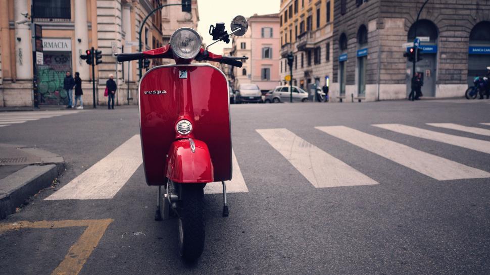 Free Image of Red Scooter Parked on the Side of the Road 