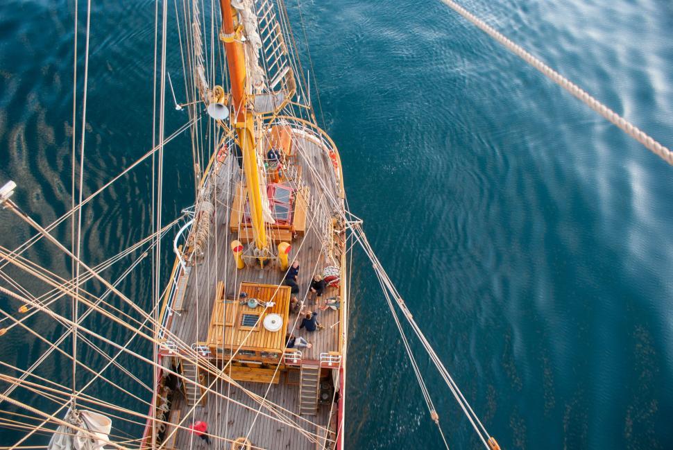 Free Image of A Large Boat Sailing in the Middle of a Body of Water 