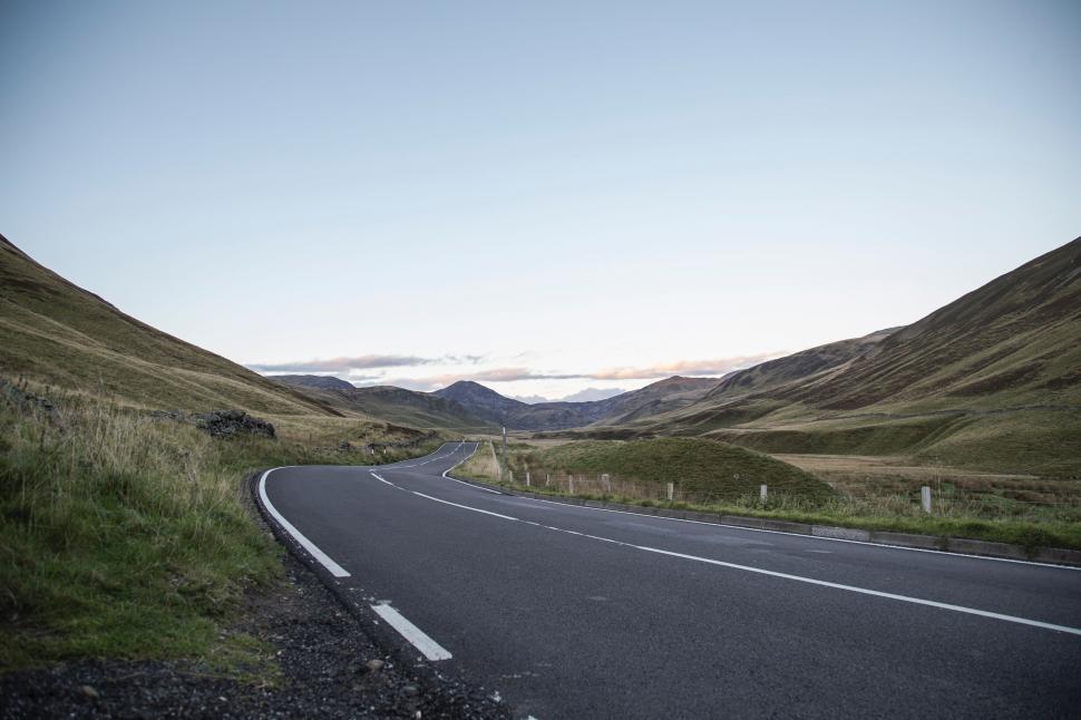 Free Image of Curved Road Cutting Through Mountain Range 