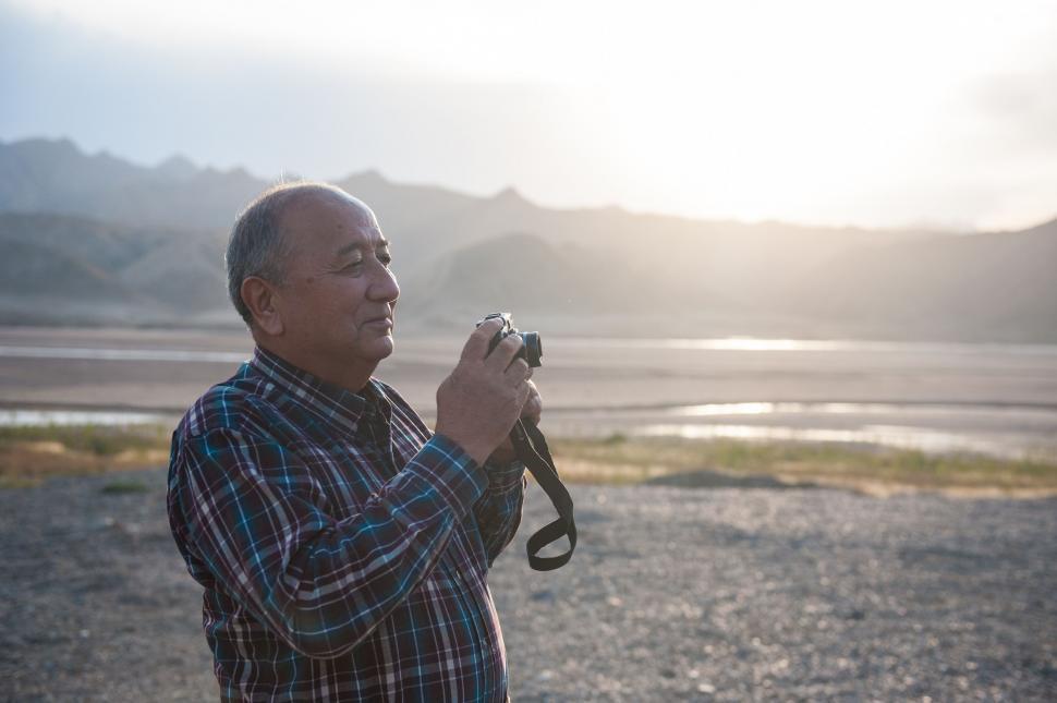 Free Image of Man Taking a Picture With a Camera 