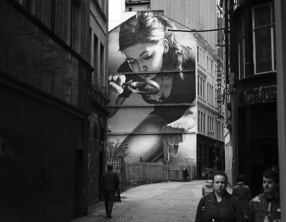 Free Image of People Walking Down a Street 