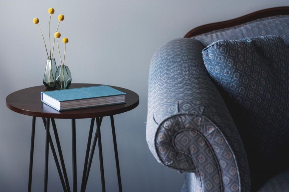 Free Image of Table With Book and Vase of Flowers 
