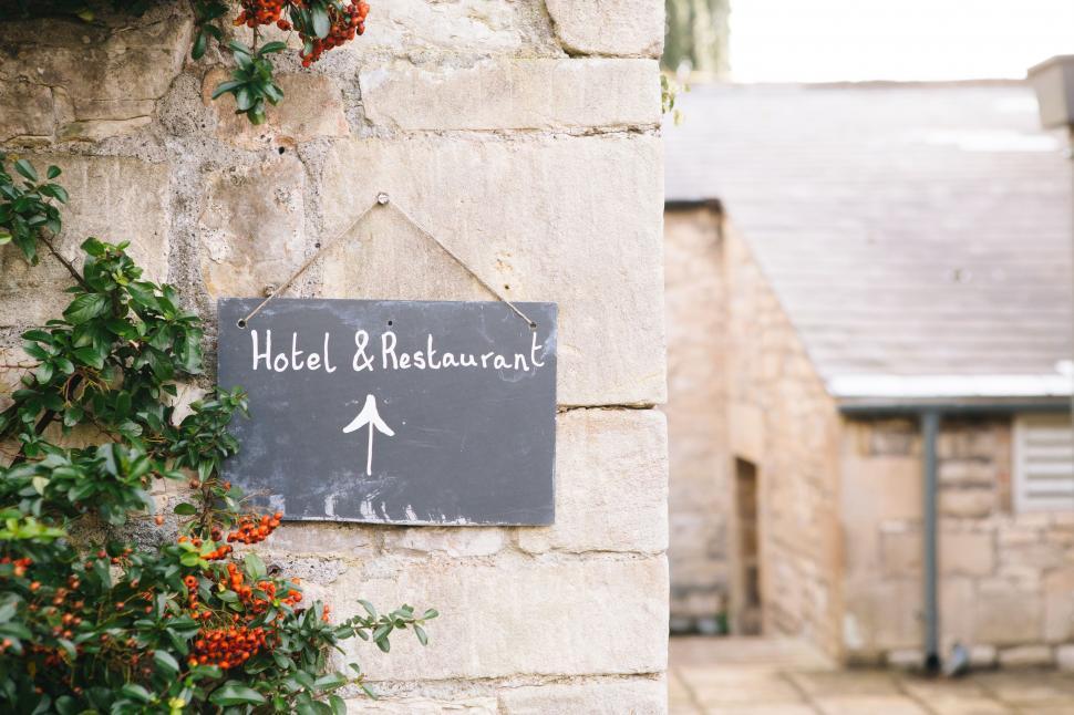 Free Image of Hotel Restaurant Sign on Building 