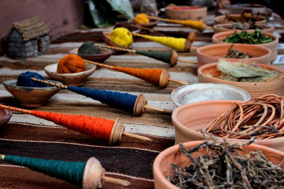 Free Image of Table Topped With Bowls of Various Yarn Types 