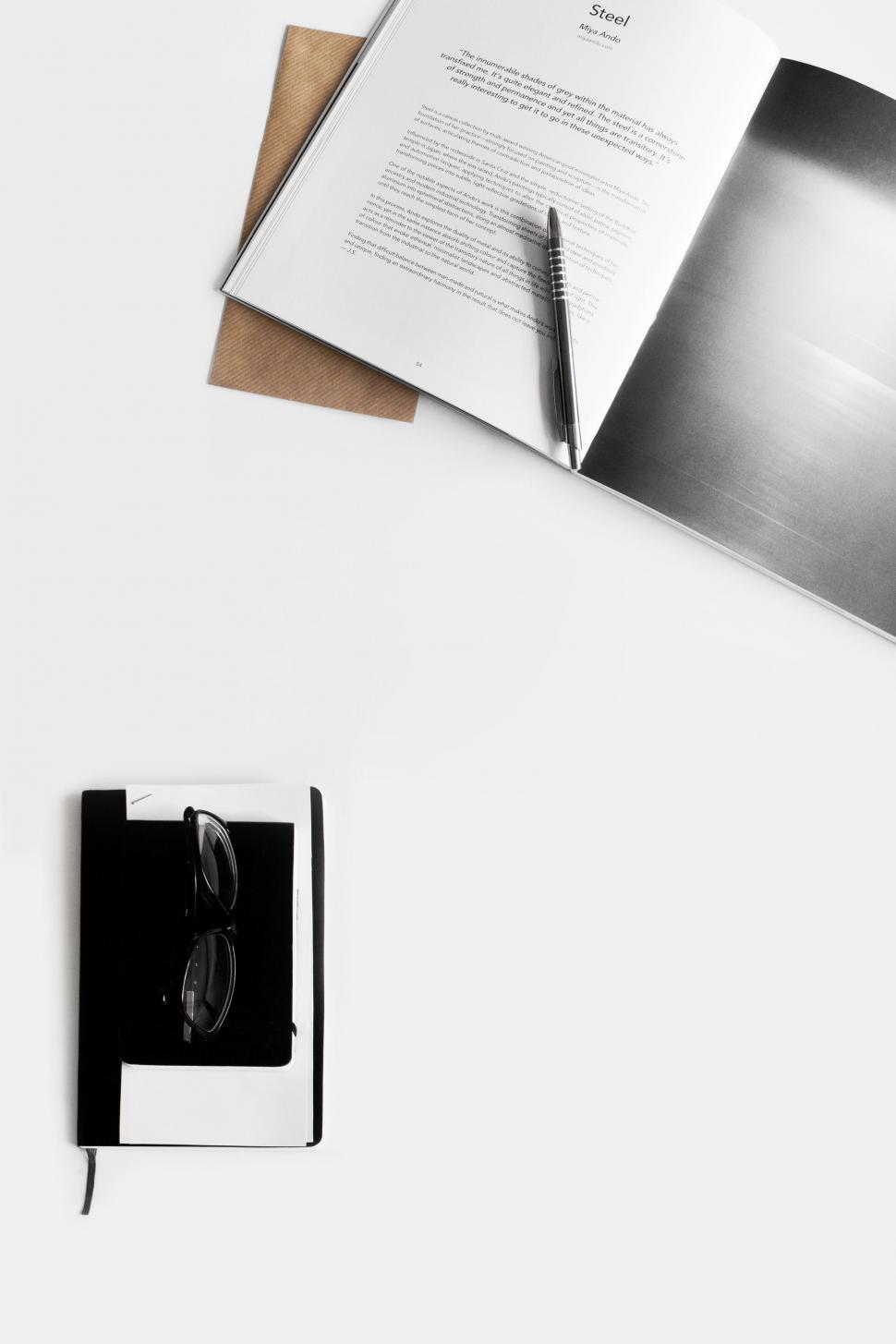 Free Image of Open Book and Headphones on Table 