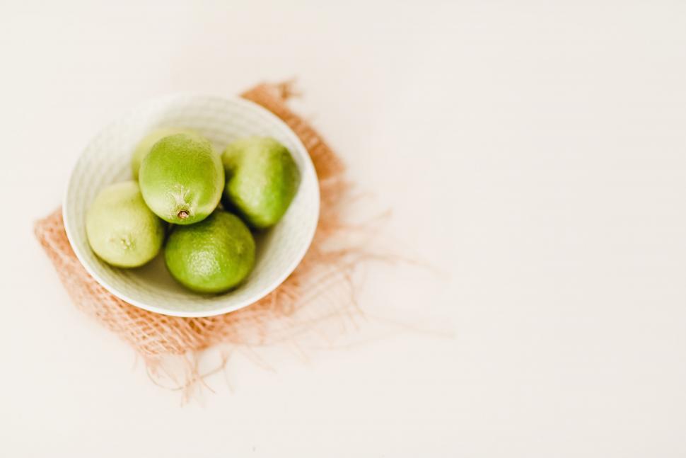 Free Image of White Bowl Filled With Green Apples on Table 