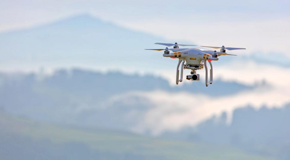 Free Image of White and Black Remote Controlled Flying in the Sky 