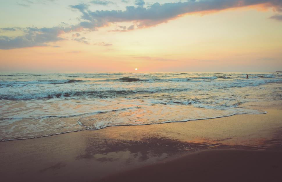 Free Image of Waves Rolling Onto Sandy Beach 