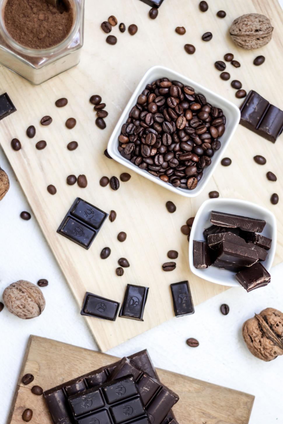 Free Image of Wooden Cutting Board With Chocolate and Nuts 
