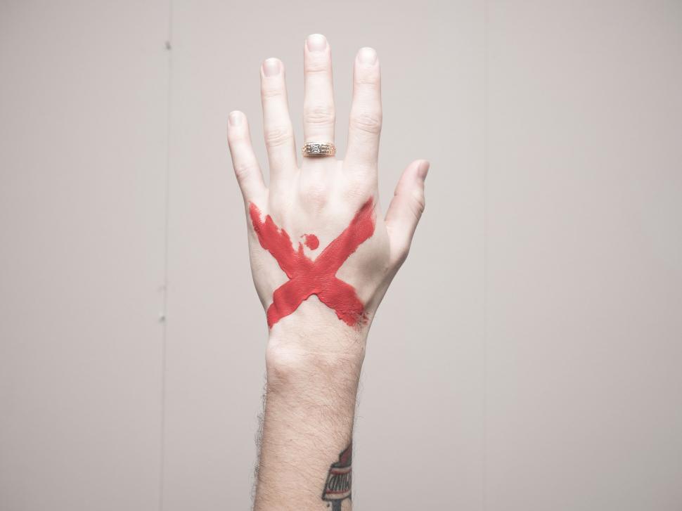 Free Image of Hand With Painted X 