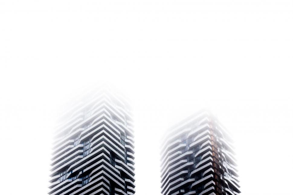 Free Image of Two Tall Buildings in Black and White 