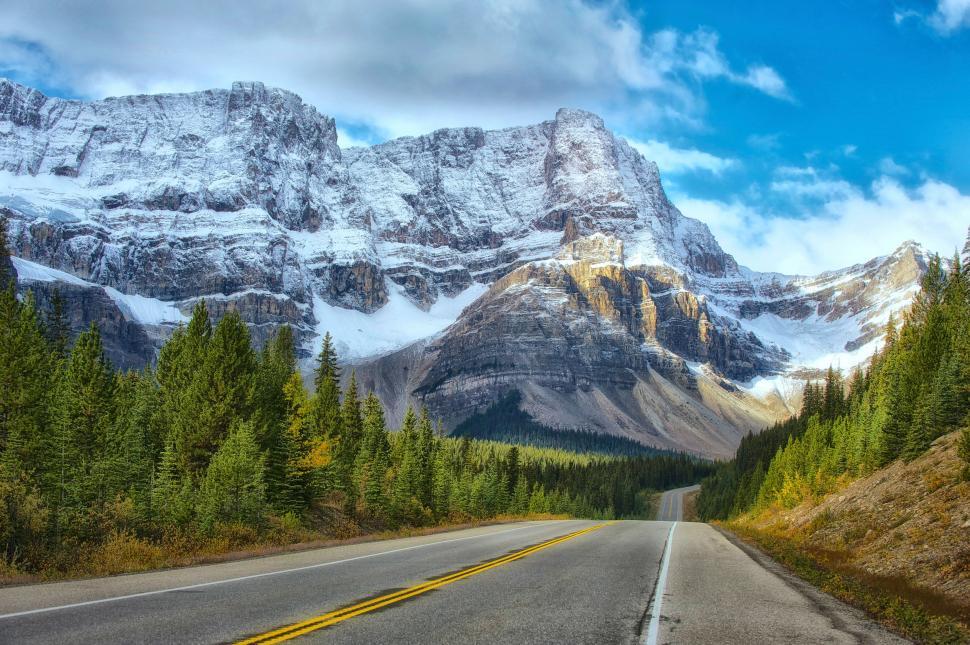 Free Image of Mountain Range With Road in Foreground 