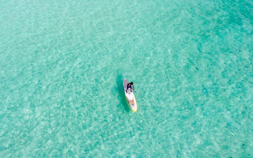 Free Image of Person Surfing on a Surfboard in the Water 