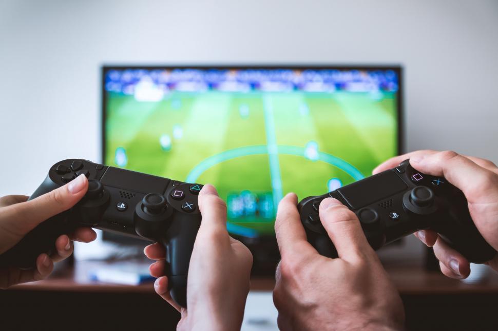 Free Image of Two People Playing a Video Game in Front of a TV 