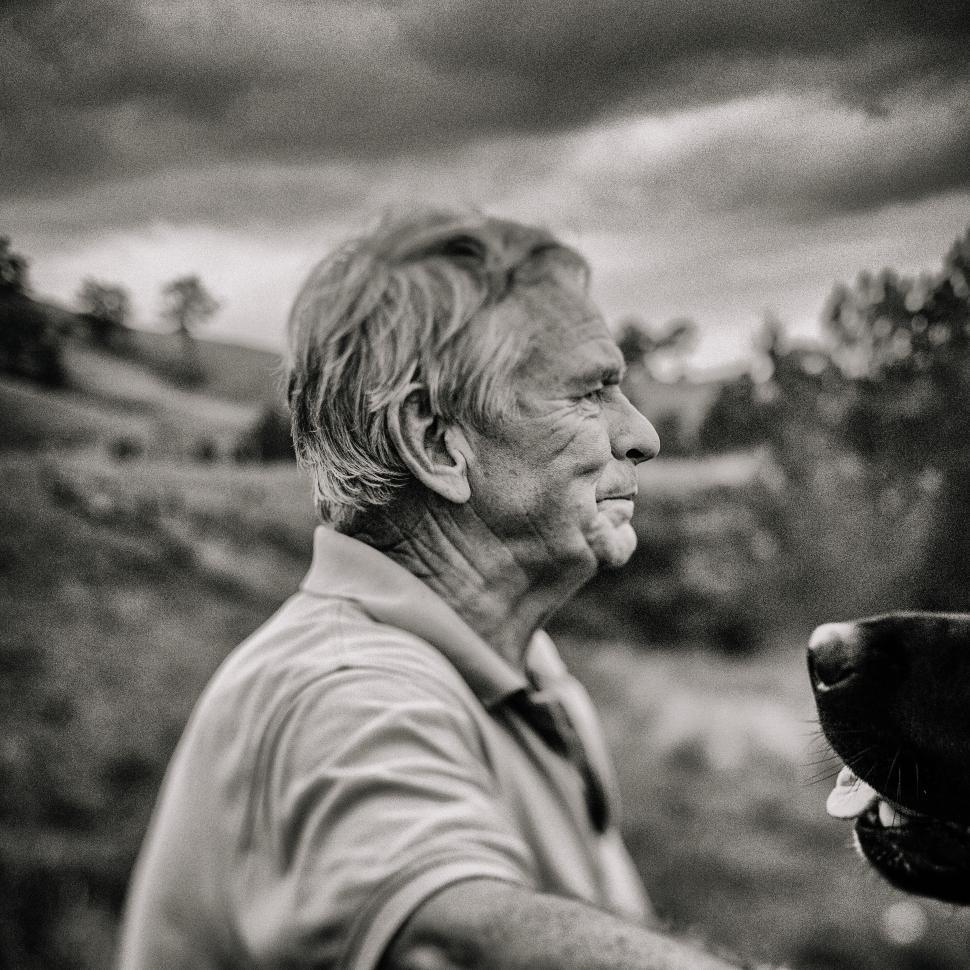 Free Image of Man Holding Motorcycle Helmet 