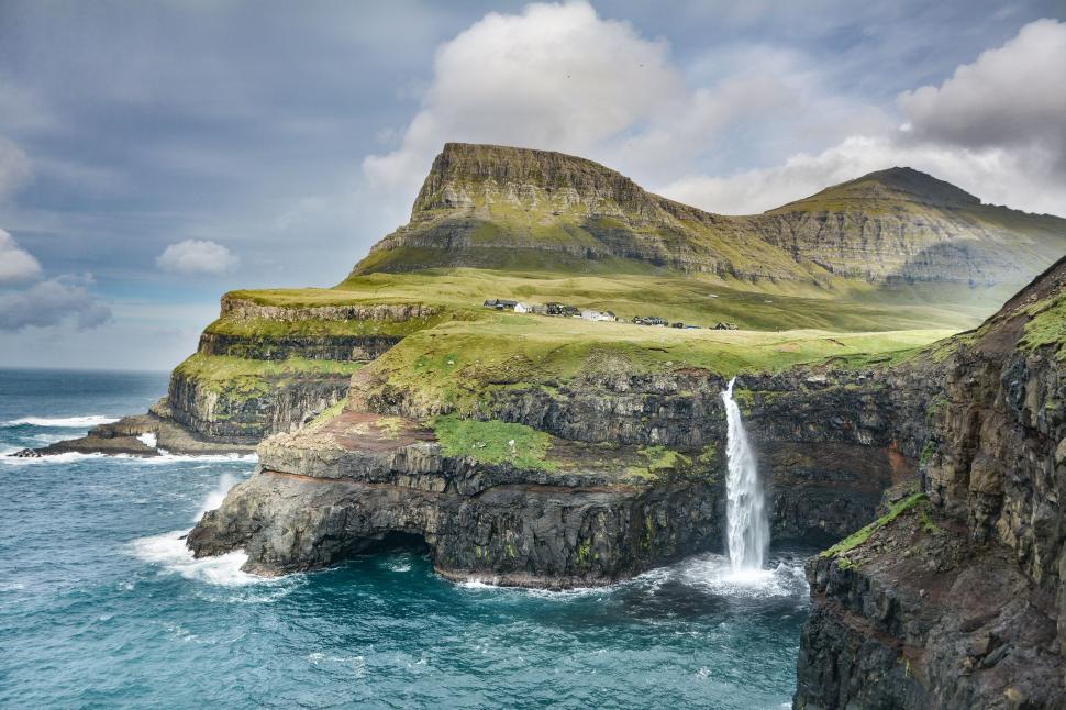 Free Image of Waterfall Cascading in Body of Water 