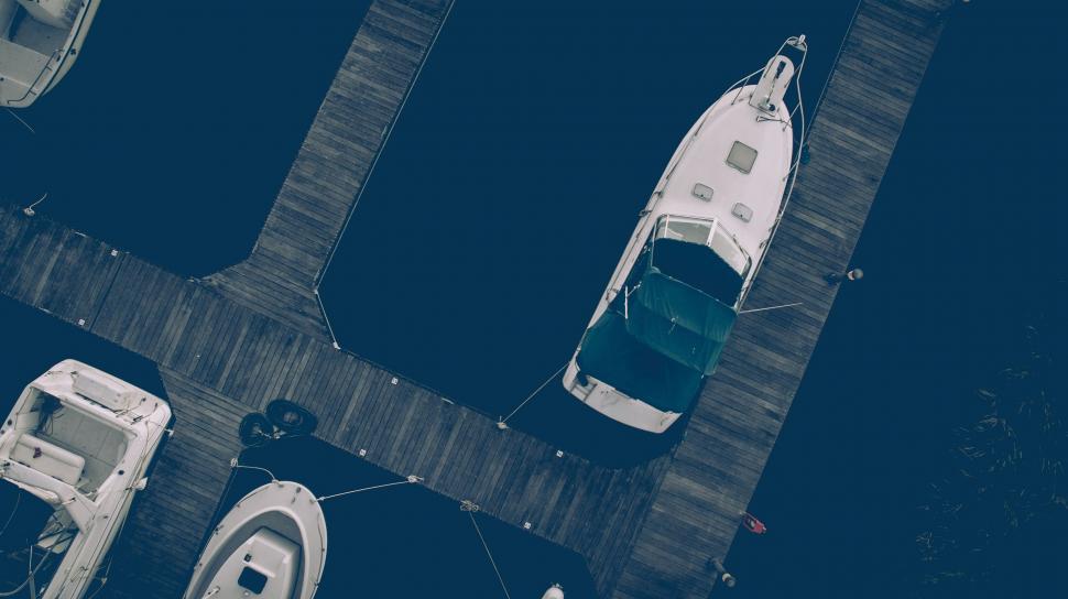 Free Image of Boat Tied to Dock in Aerial View 