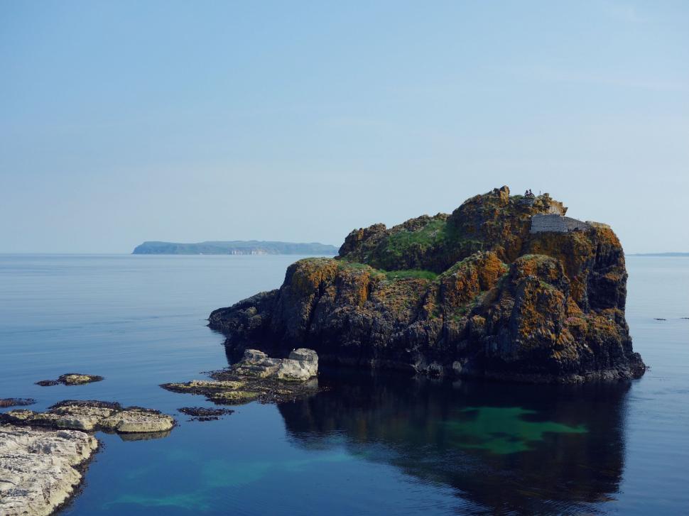 Free Image of Large Rock in Middle of Body of Water 