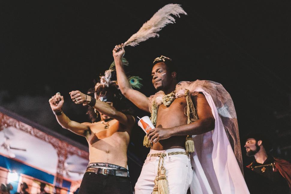Free Image of Men Standing Together on Stage 