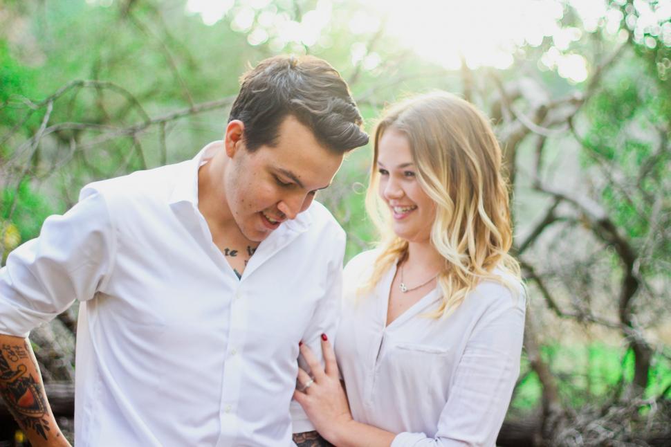 Free Image of A Man and a Woman Standing Next to Each Other 