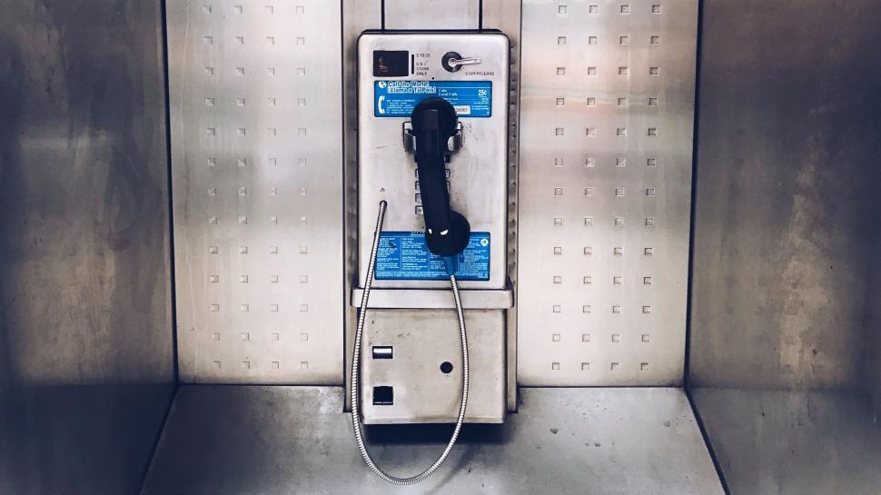 Free Image of Old Phone Rests on Table in Room 
