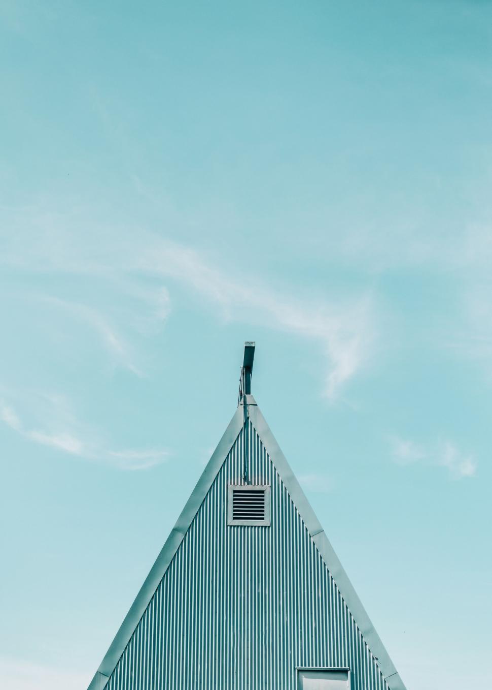 Free Image of Tall Building With Flag on Top 