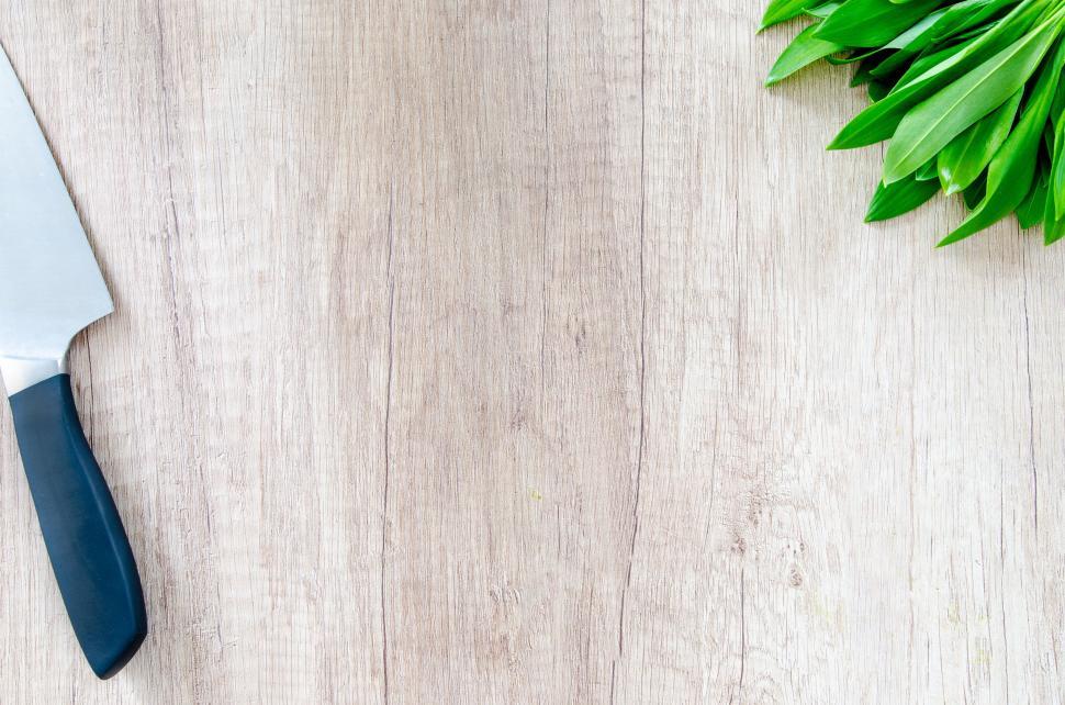 Free Image of Knife and Green Leaves on Table 