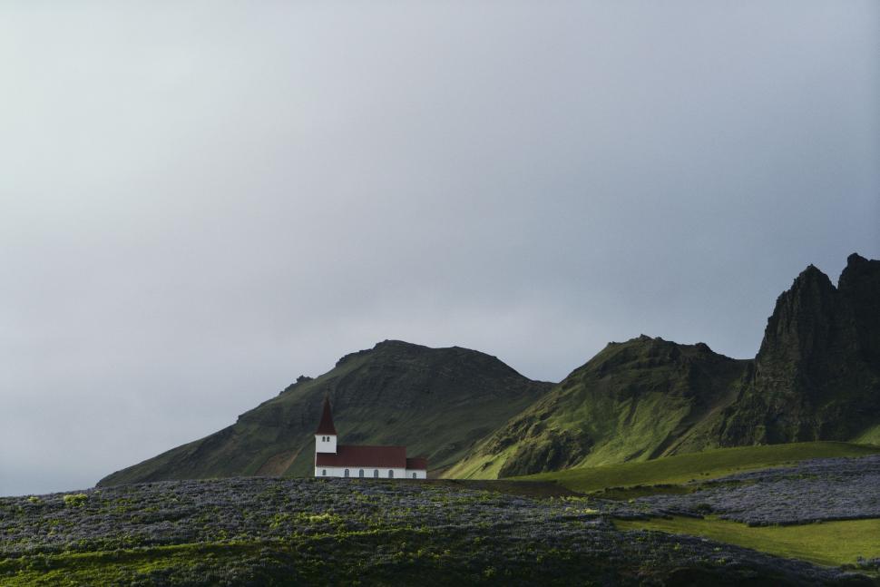 Free Image of White House on Lush Green Hillside 