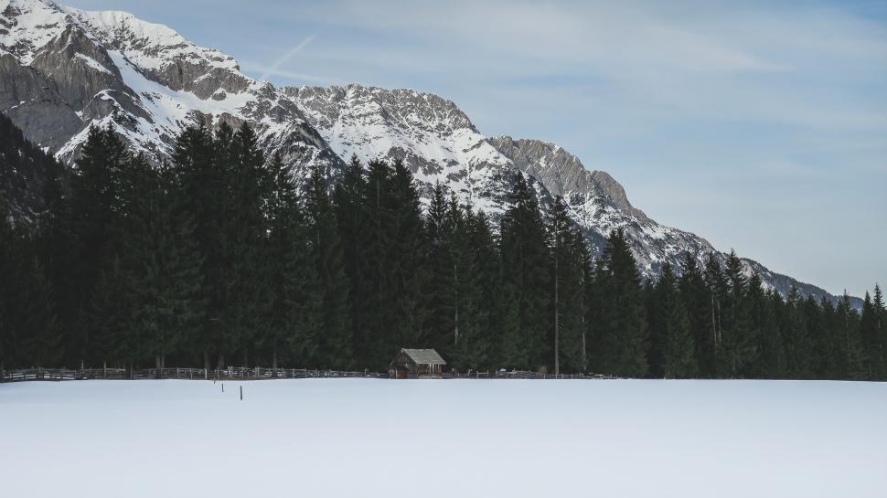 Free Image of Man Skiing Down Snow Covered Slope 