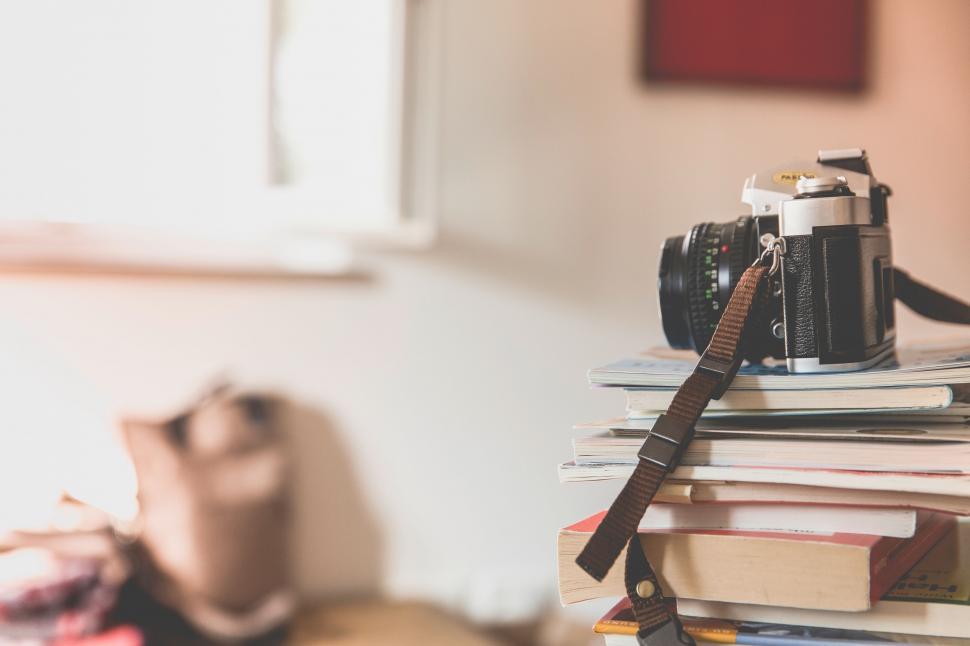 Free Image of Camera on Stack of Books 