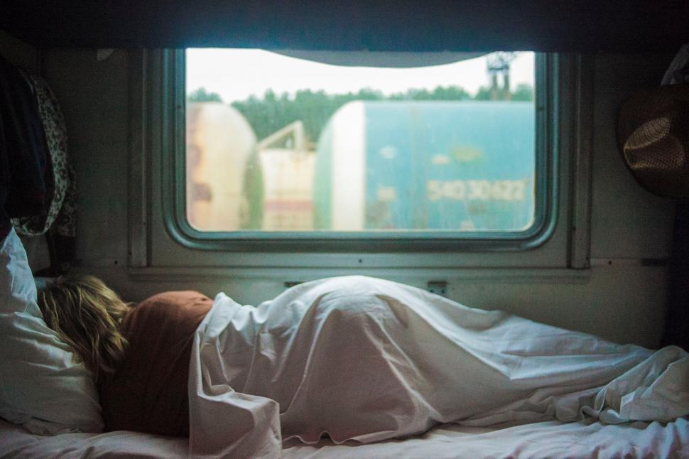 Free Image of Person Laying on Bed in Room 