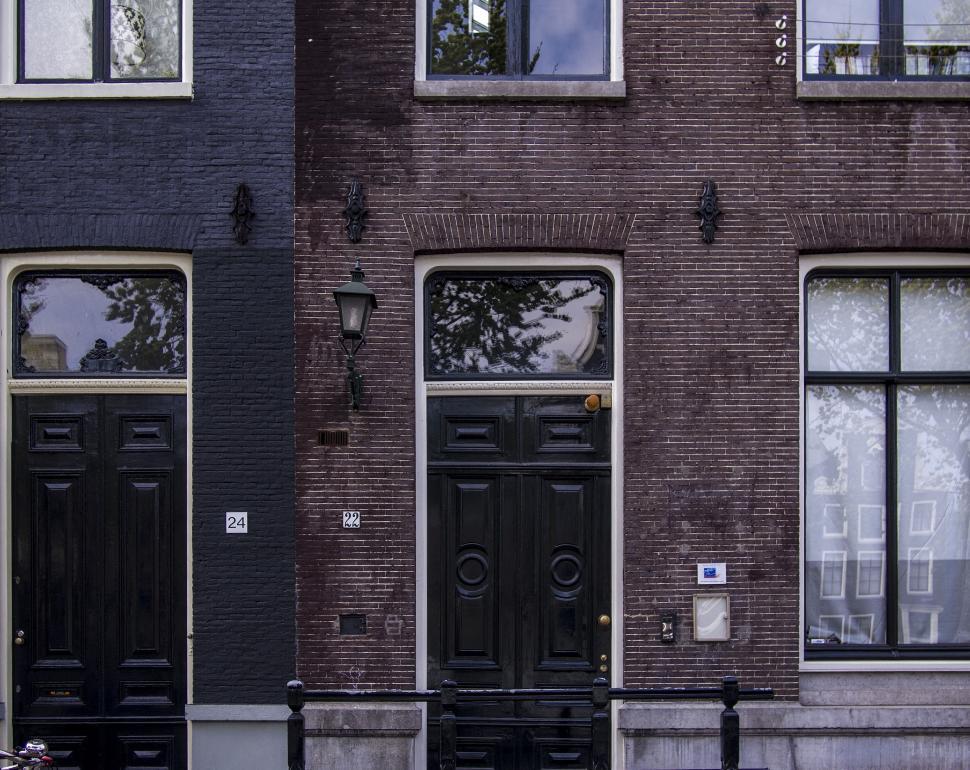Free Image of Two Black Doors in Front of Building 