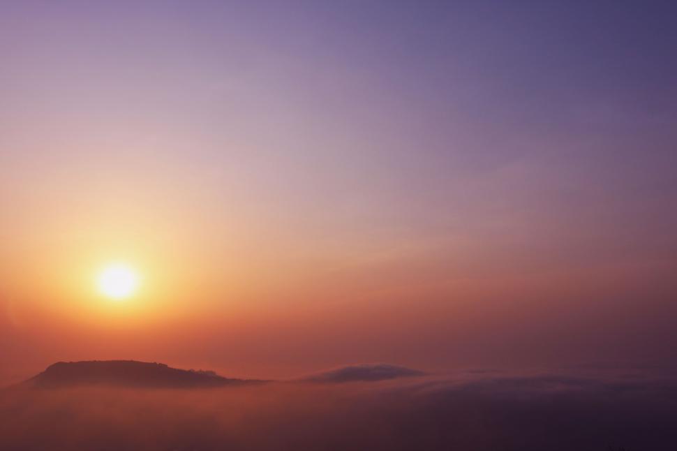 Free Image of Sun Setting Over Mountain Range 