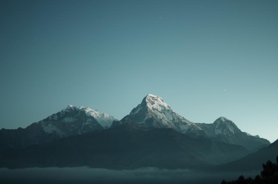 Free Image of Snow Covered Mountain Range in the Distance 
