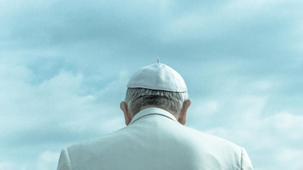 Free Image of Man in White Suit and Hat 