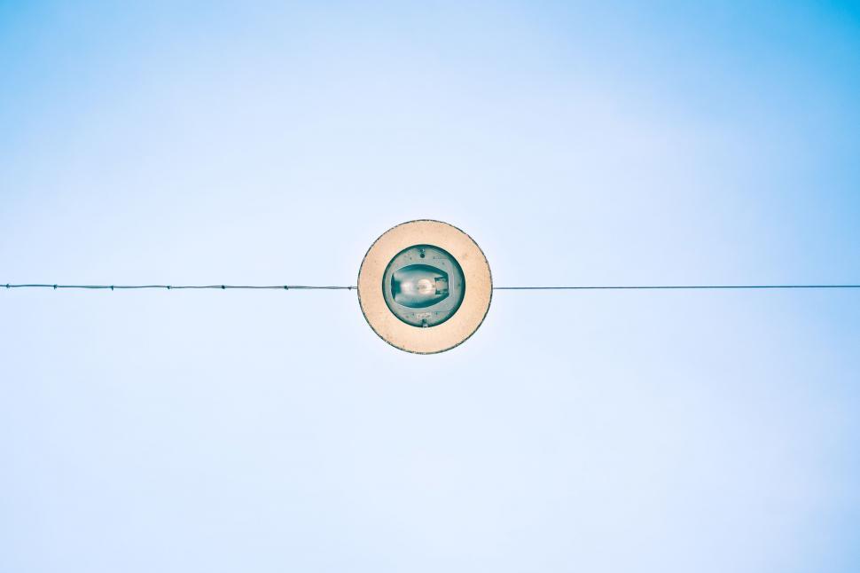 Free Image of Persons Shadow on Wire With Clock 