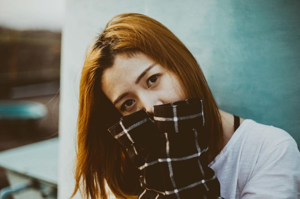 Free Image of Woman With Red Hair Wearing Plaid Scarf 