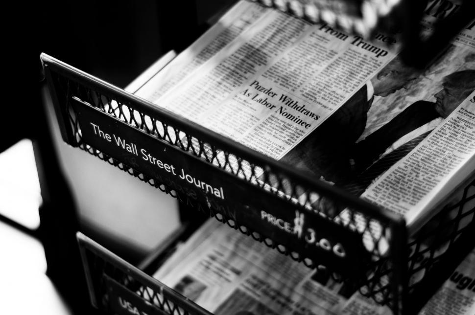 Free Image of Stack of Newspapers on Table 