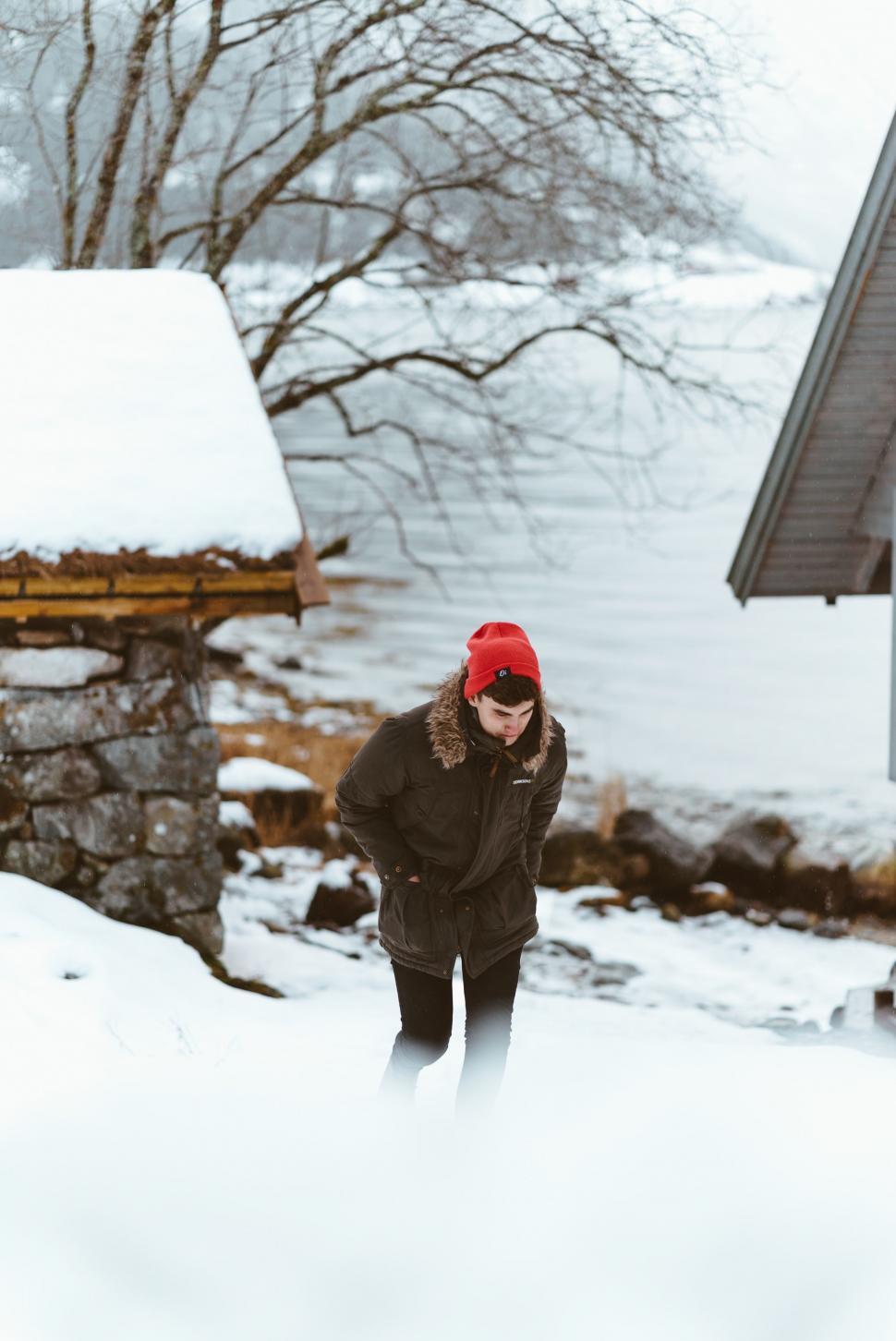 Free Image of Person Standing in Snow Talking on Cell Phone. 
