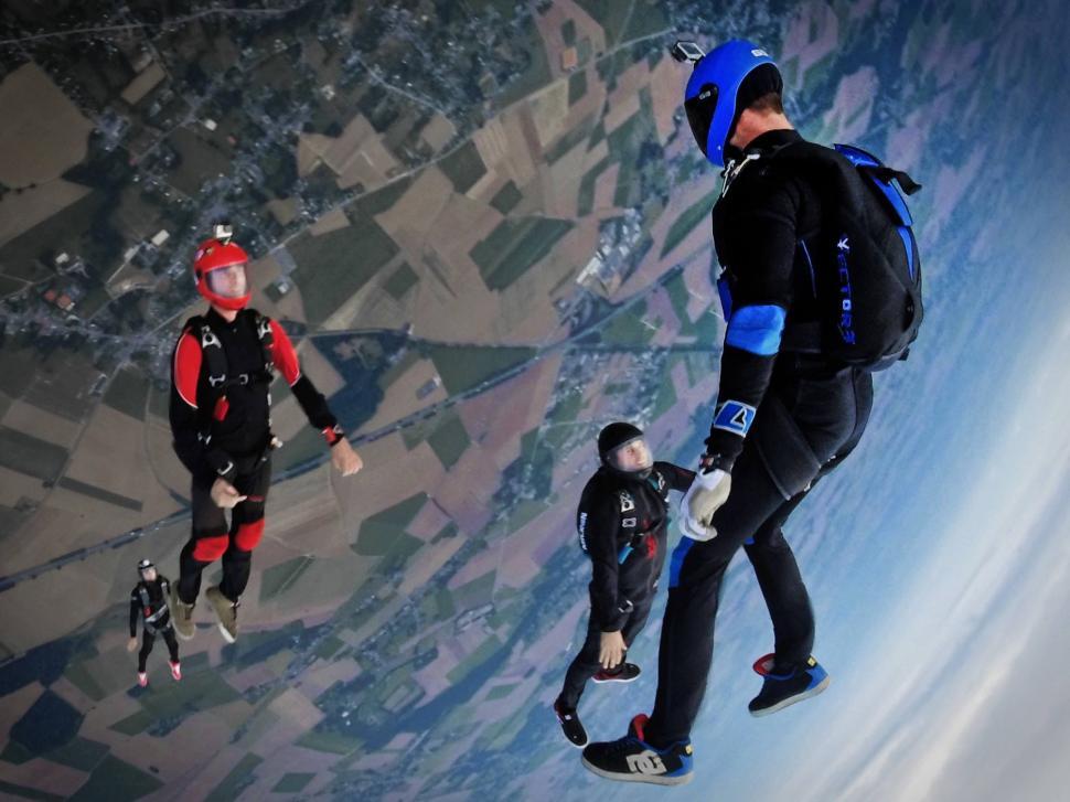 Free Image of Group of People Flying Through the Air 