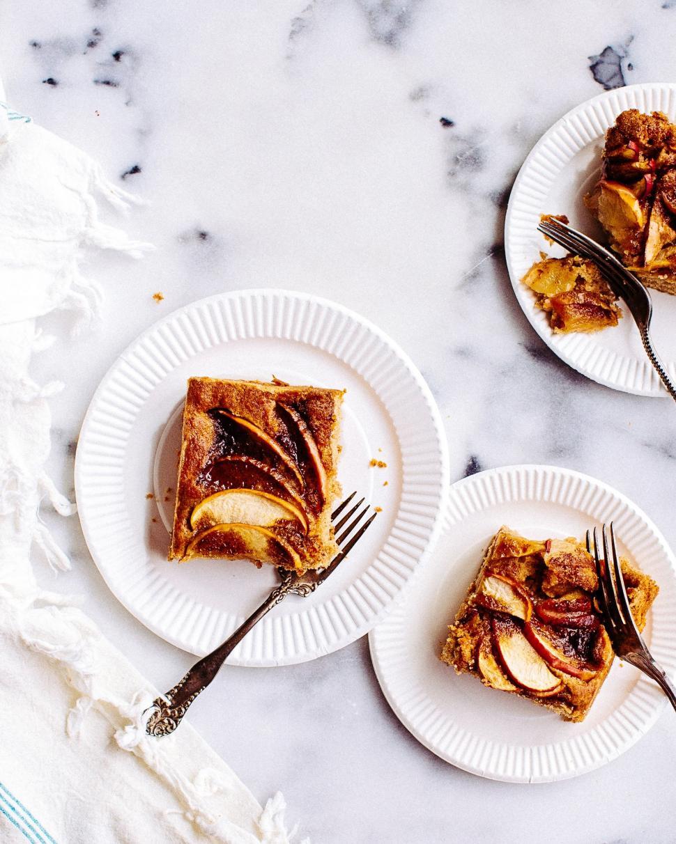 Free Image of Two White Plates Topped With Slices of Dessert 