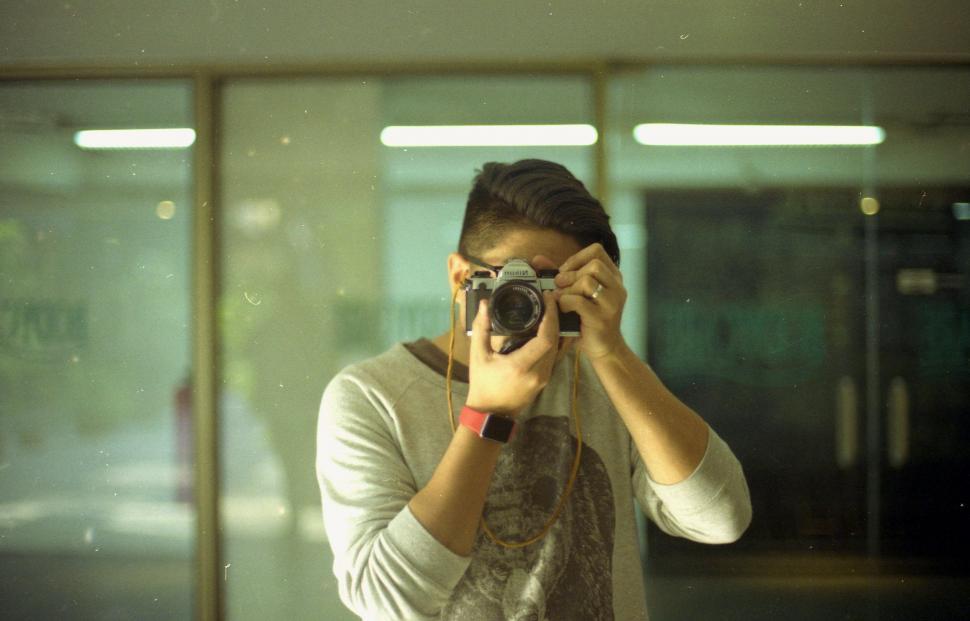 Free Image of Man Taking Selfie in Mirror 