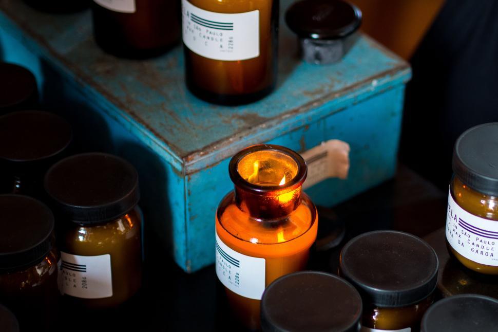 Free Image of Table With Numerous Liquid-filled Jars 