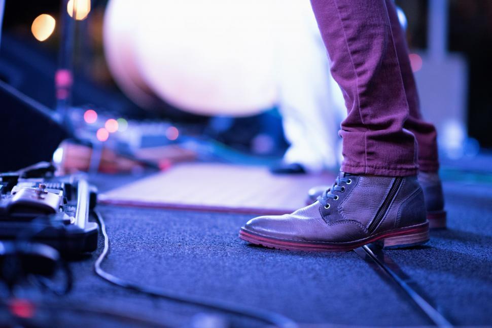 Free Image of Person Standing on Stage With Microphone 