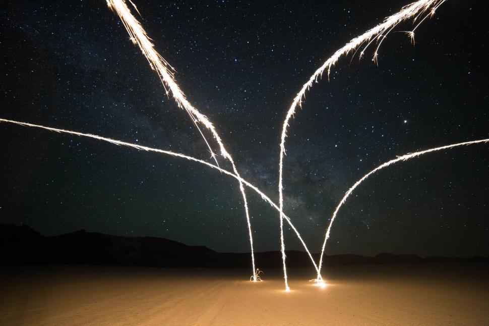Free Image of Two Fireworks Exploding in the Night Sky 