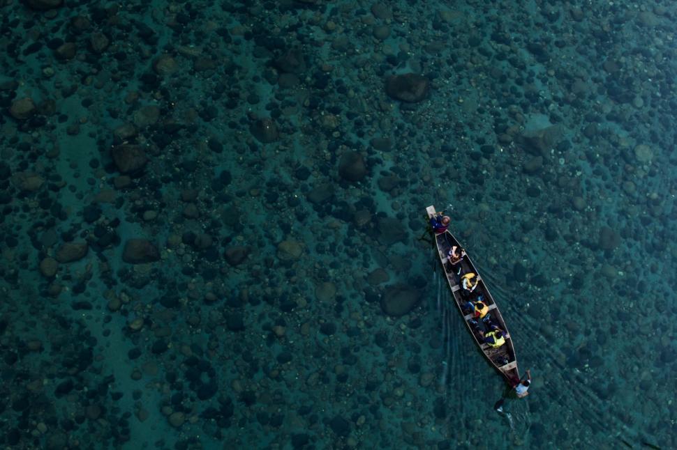Free Image of Boat Floating on Body of Water 