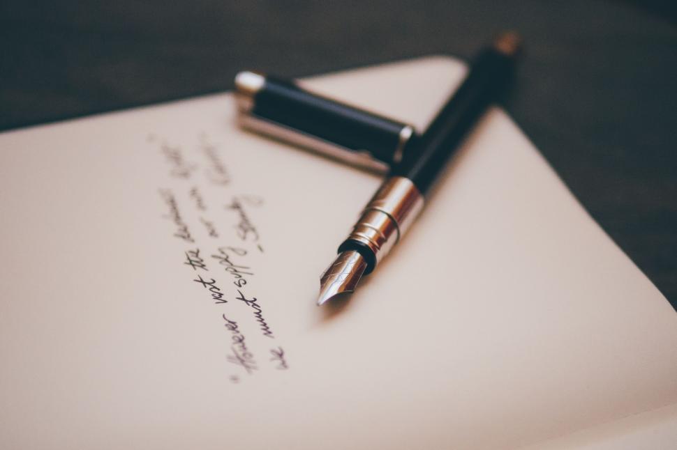 Free Image of Pen on Top of Paper 