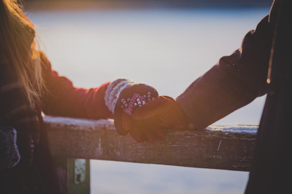 Free Image of Two People Holding Hands Standing Together 